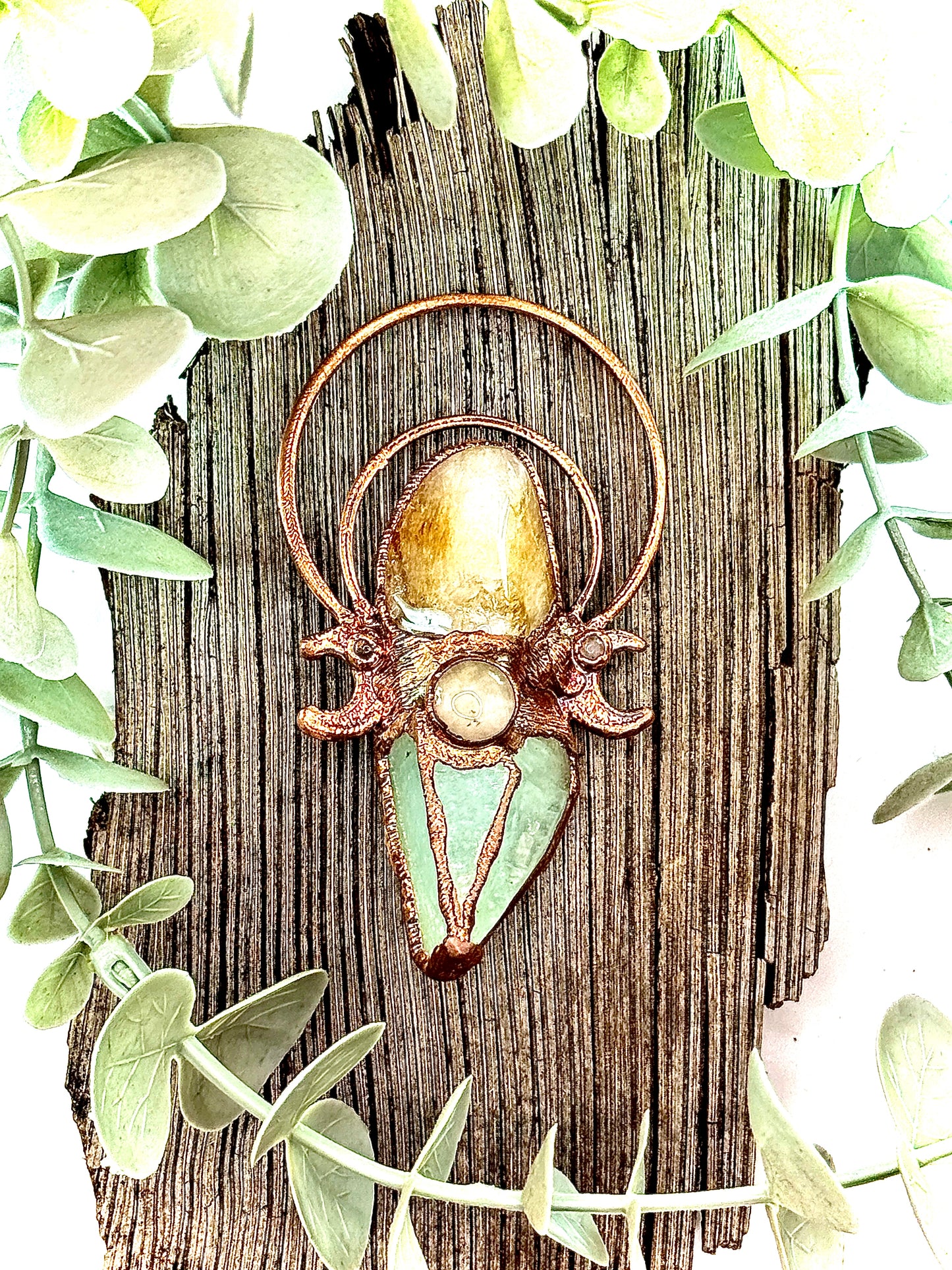 Handmade copper pendant with carnelian, green calcite, yellow jade cabochon, and crescent moons – crystal jewellery for confidence and heart healing.