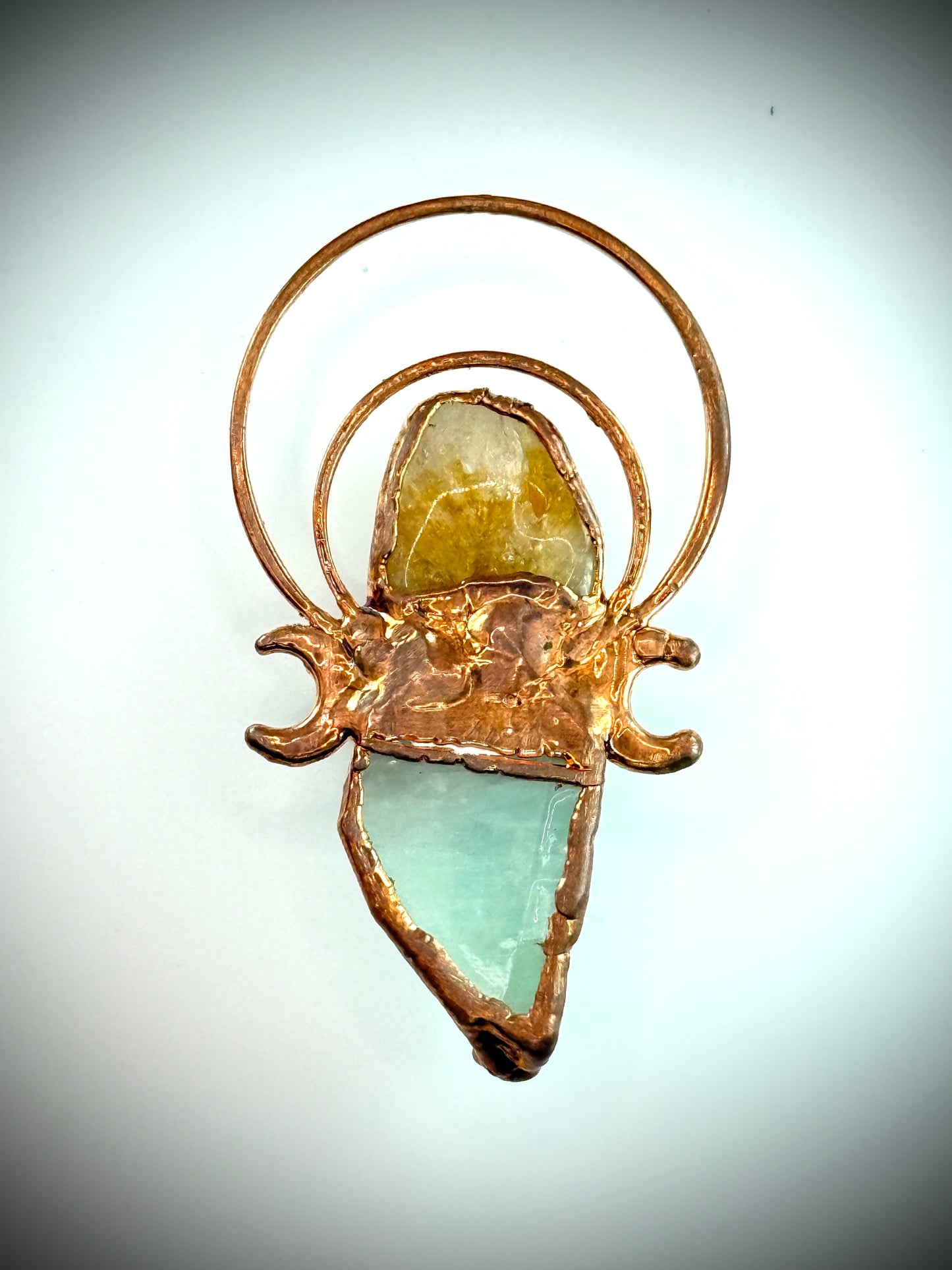 Handmade copper pendant with carnelian, green calcite, yellow jade cabochon, and crescent moons – crystal jewellery for confidence and heart healing.