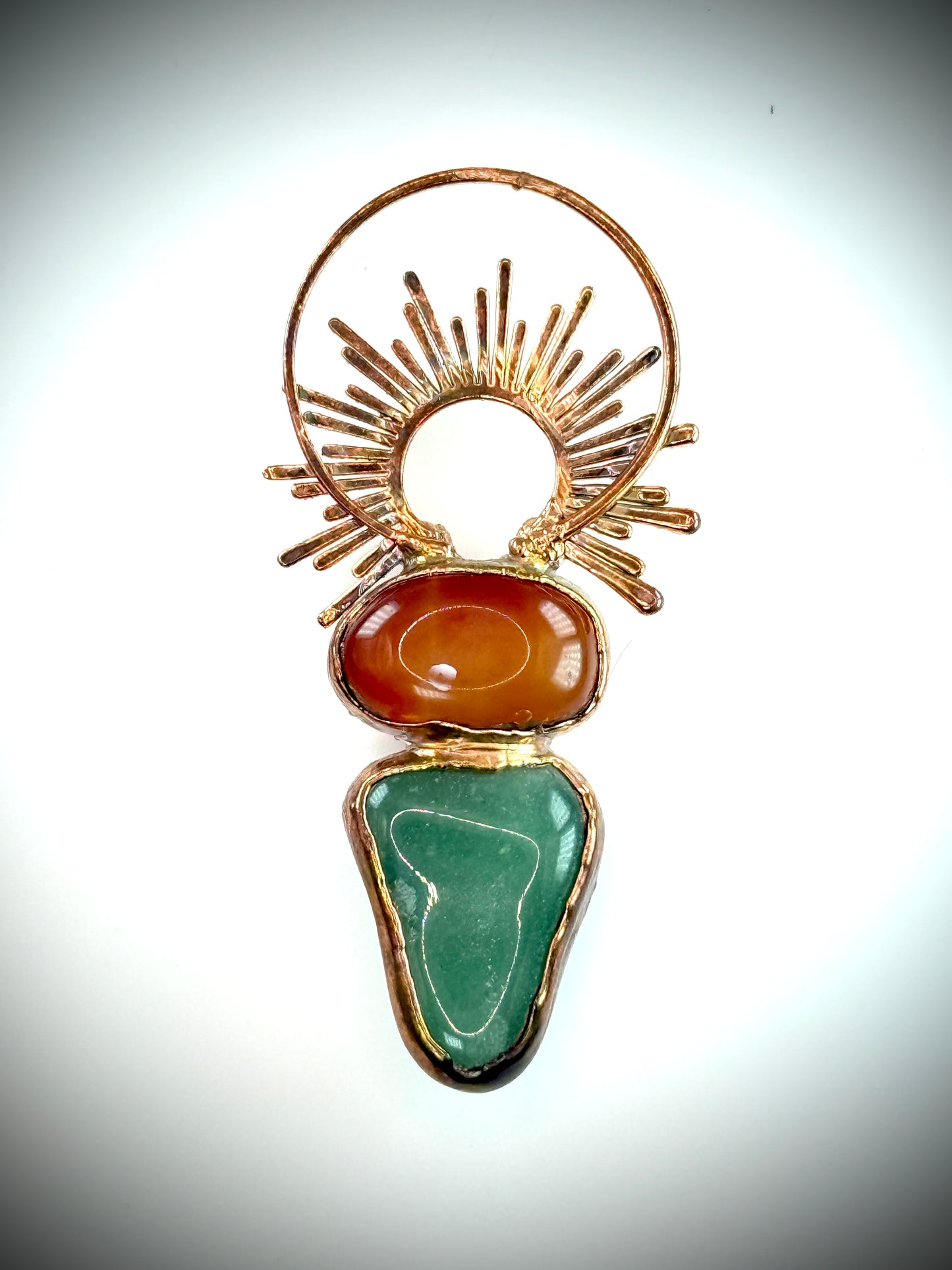 Handmade copper pendant with carnelian, green fluorite, moonstone accents, and sunburst detail – crystal jewellery for emotional balance and intuitive power.