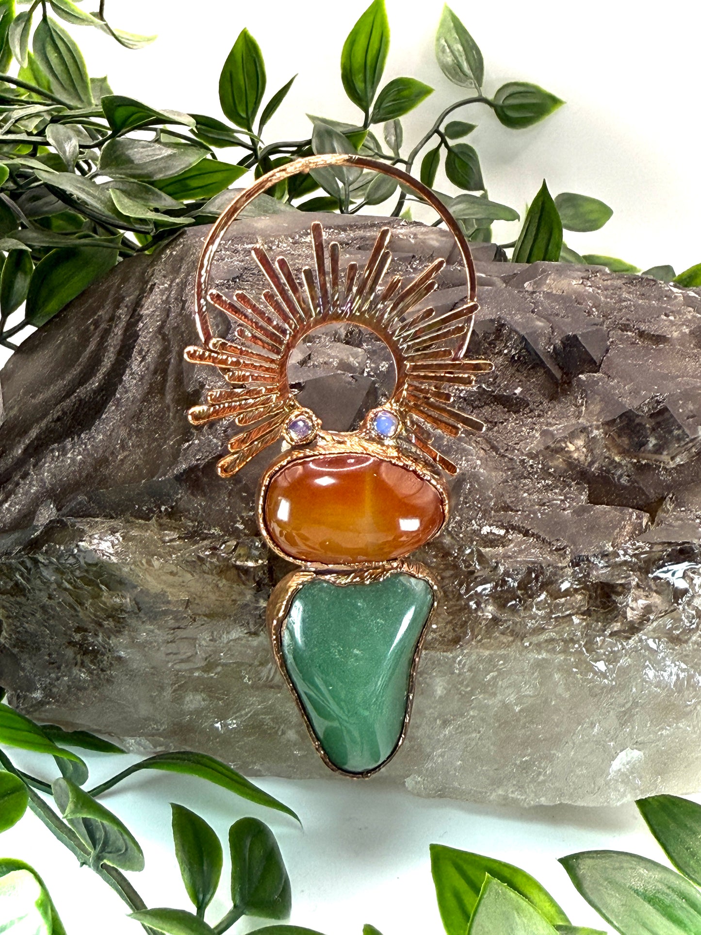 Handmade copper pendant with carnelian, green fluorite, moonstone accents, and sunburst detail – crystal jewellery for emotional balance and intuitive power.