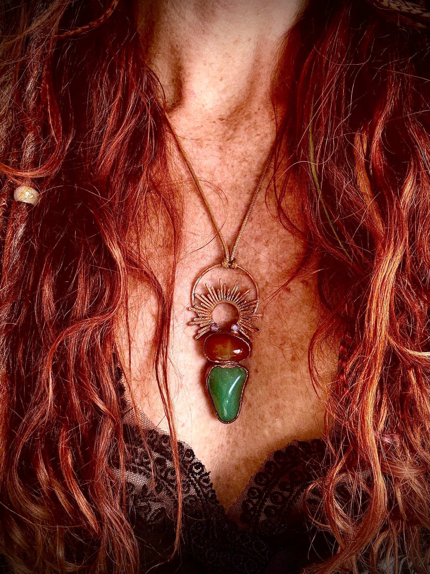 Handmade copper pendant with carnelian, green fluorite, moonstone accents, and sunburst detail – crystal jewellery for emotional balance and intuitive power.