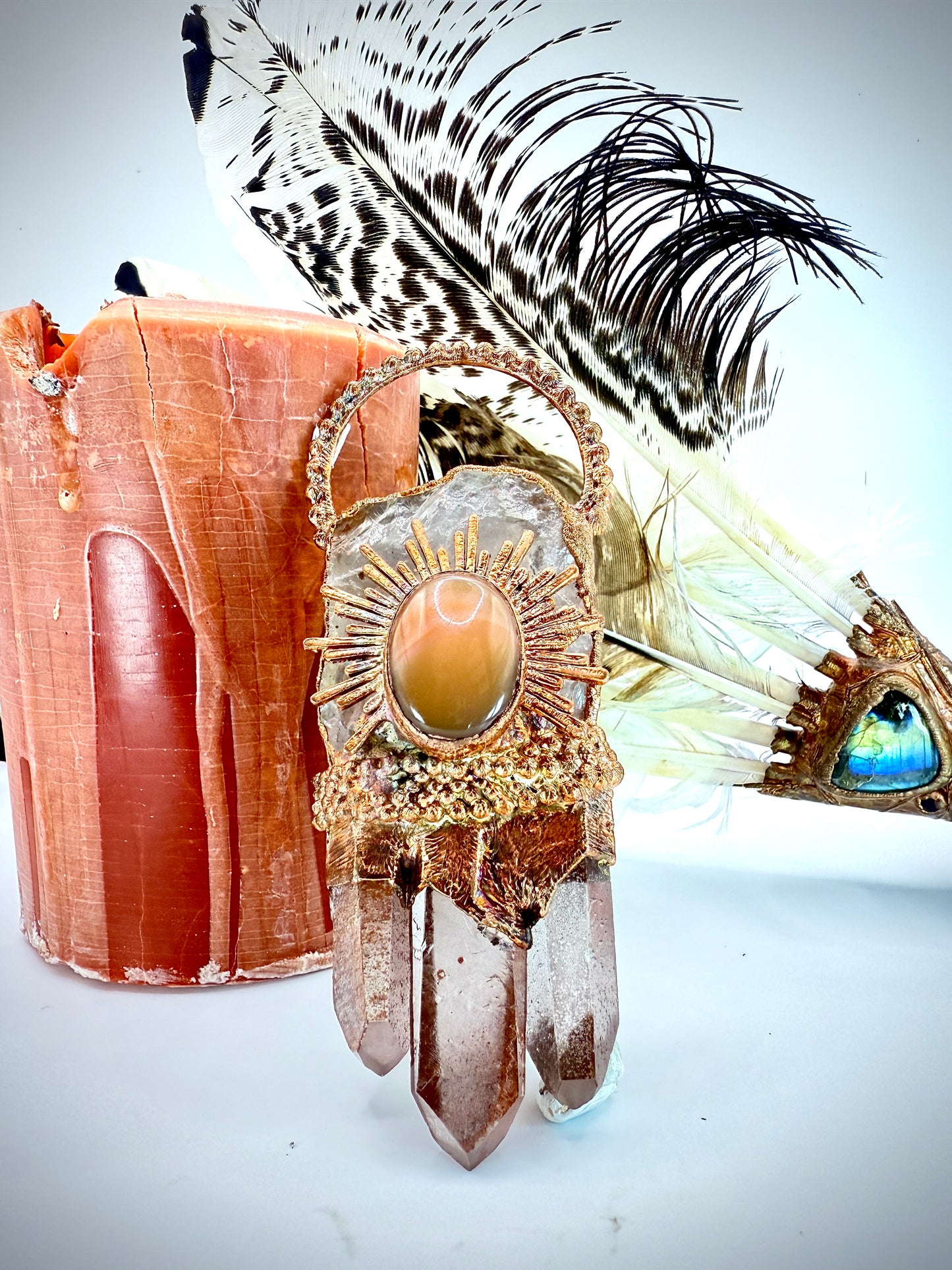 Handmade copper pendant with clear quartz crown, red lithium quartz points, carnelian cabochon, and sunburst accent – fiery crystal statement jewellery.