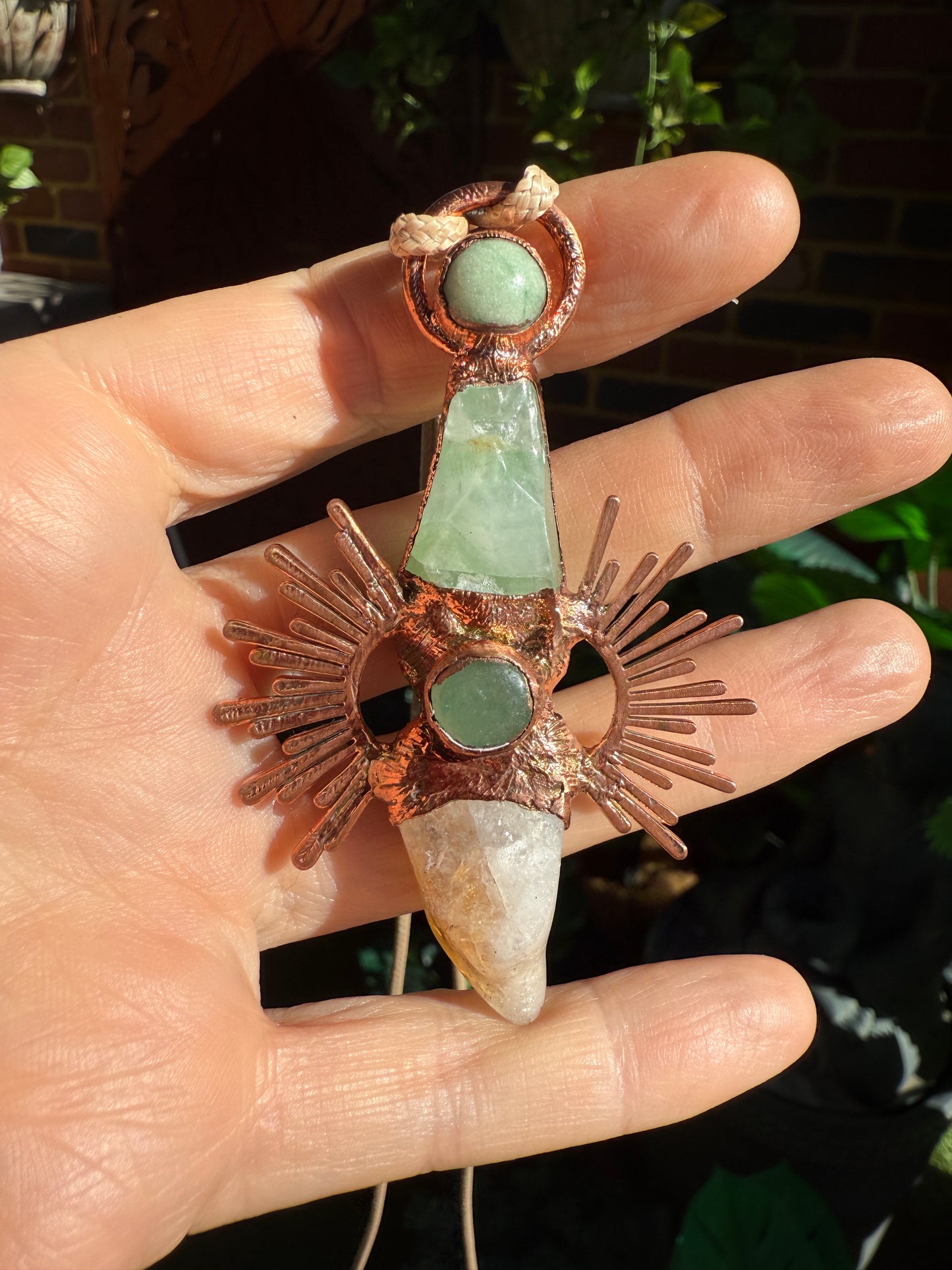 Handmade copper pendant with citrine and green calcite – sunburst design crystal jewellery for confidence and heart healing.