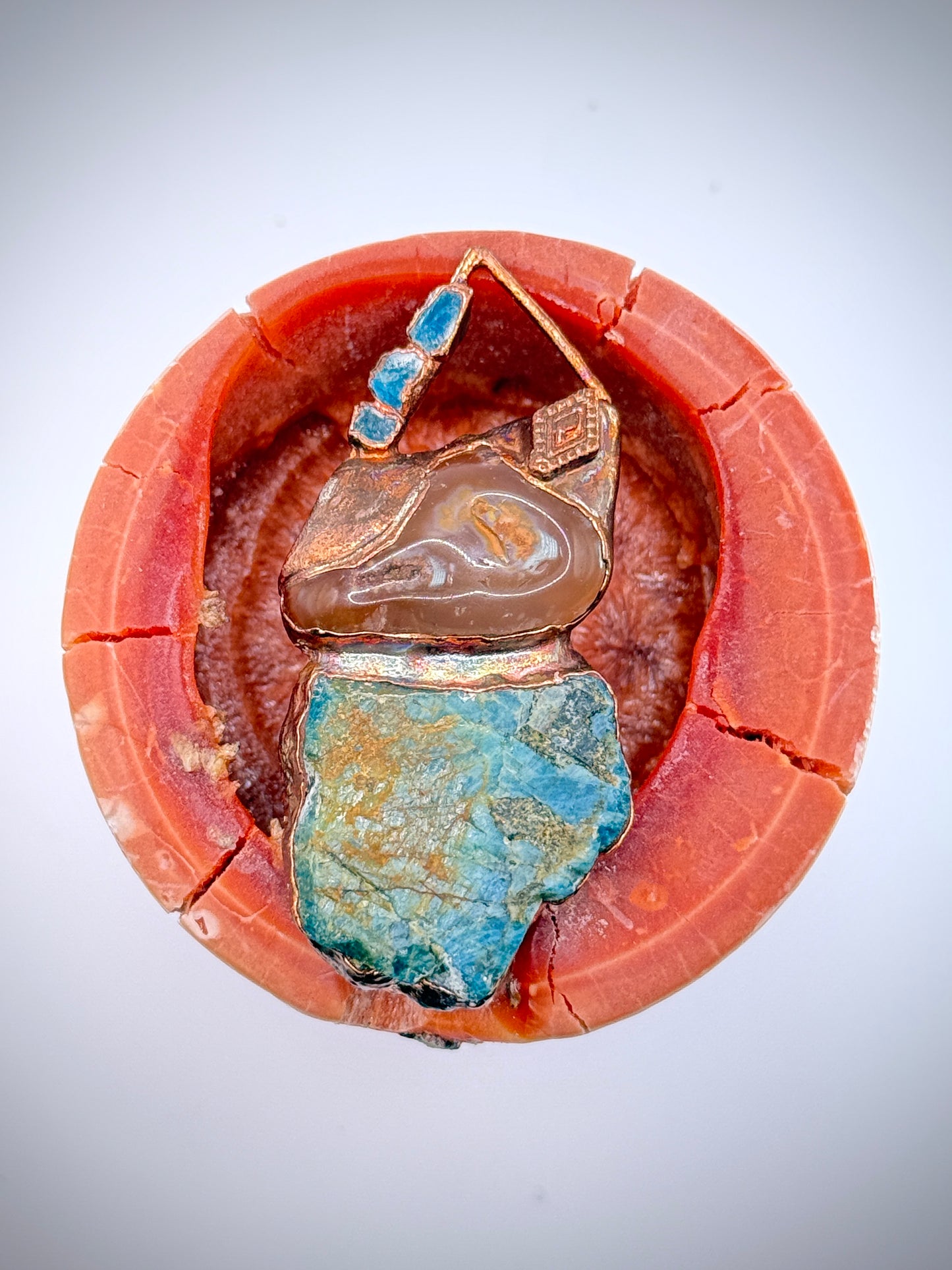 Handmade copper pendant with raw blue apatite, carnelian, and triangular top – funky crystal jewellery for creative expression and throat chakra alignment.