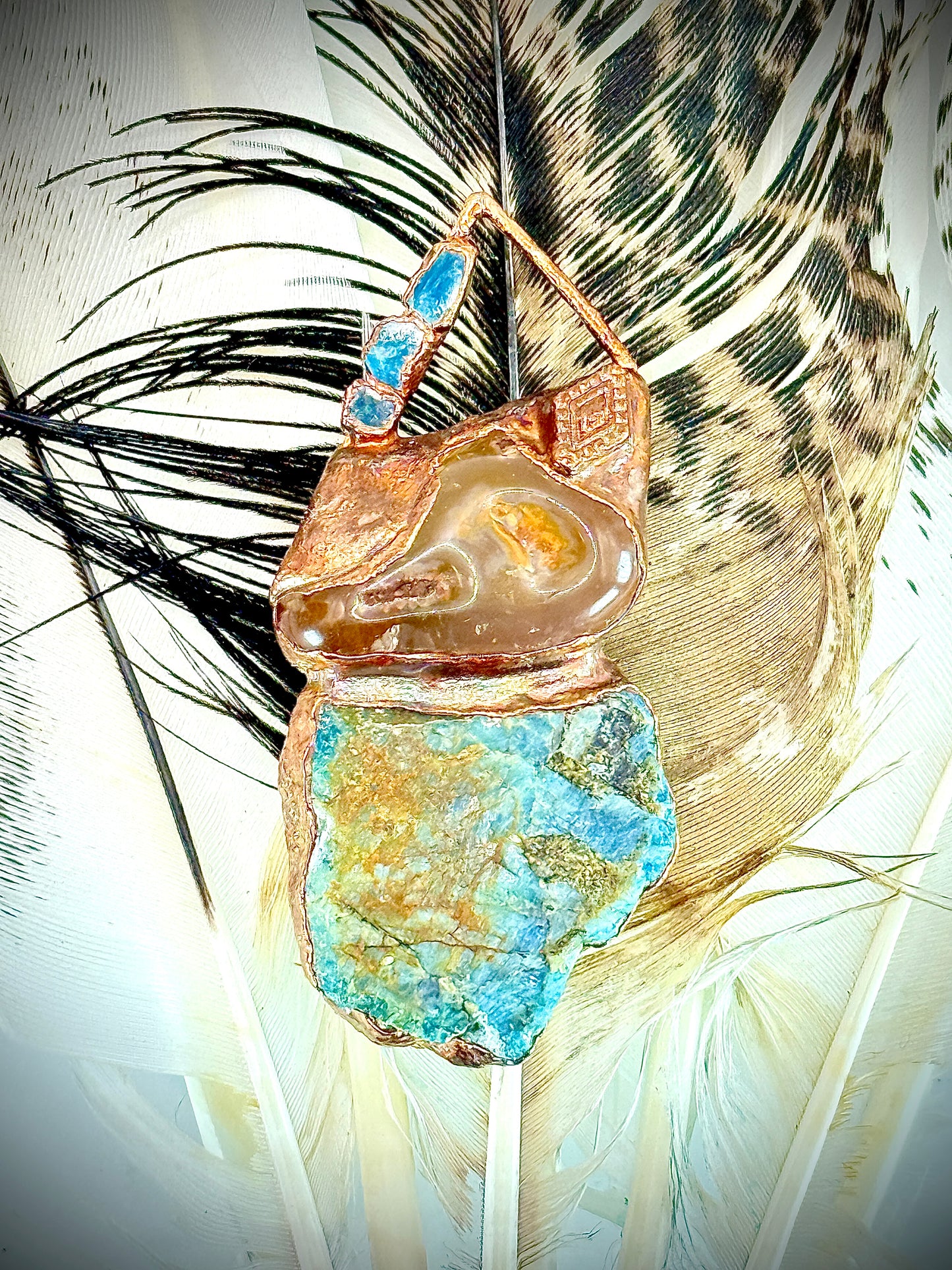 Handmade copper pendant with raw blue apatite, carnelian, and triangular top – funky crystal jewellery for creative expression and throat chakra alignment.