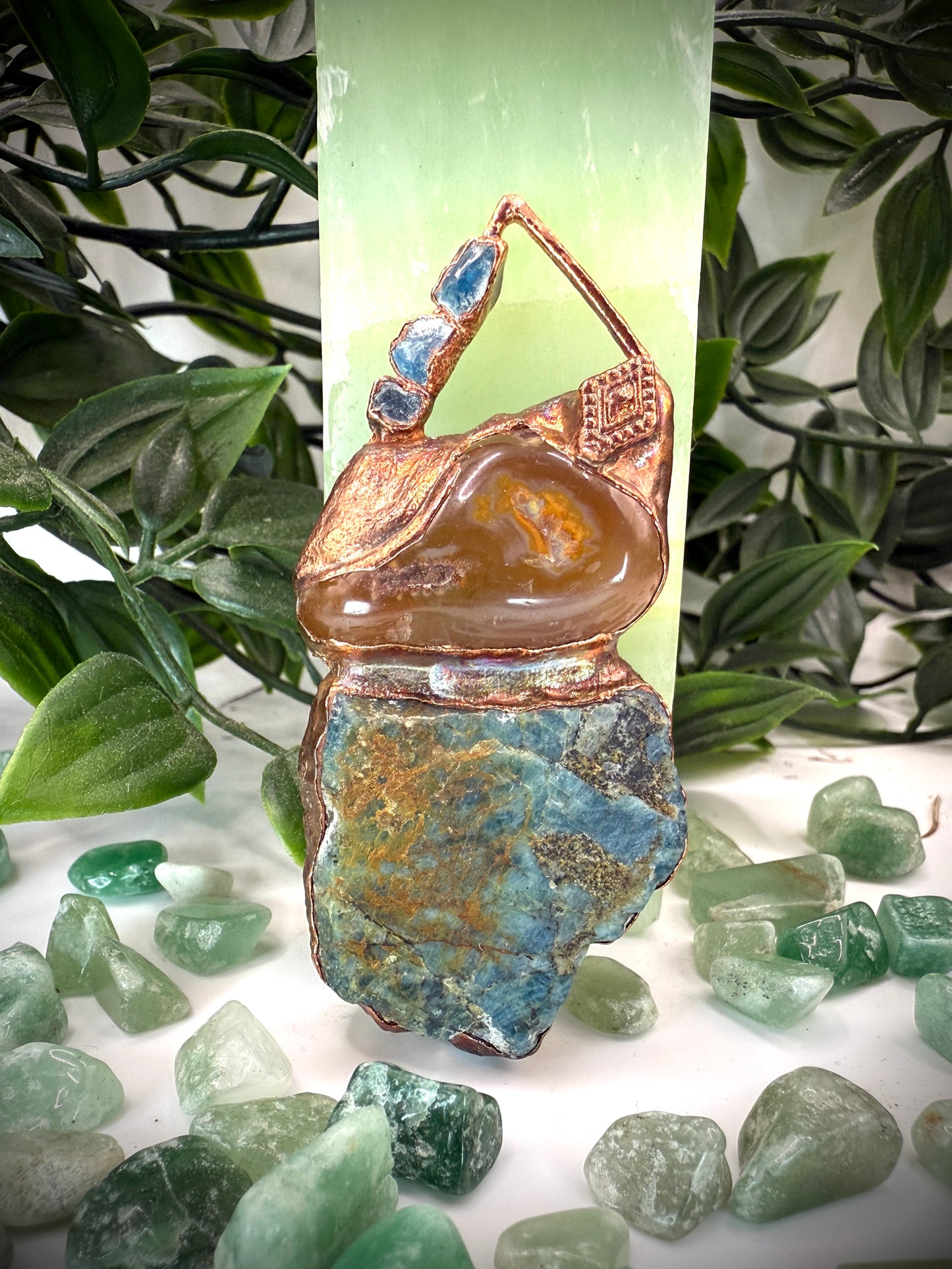 Handmade copper pendant with raw blue apatite, carnelian, and triangular top – funky crystal jewellery for creative expression and throat chakra alignment.