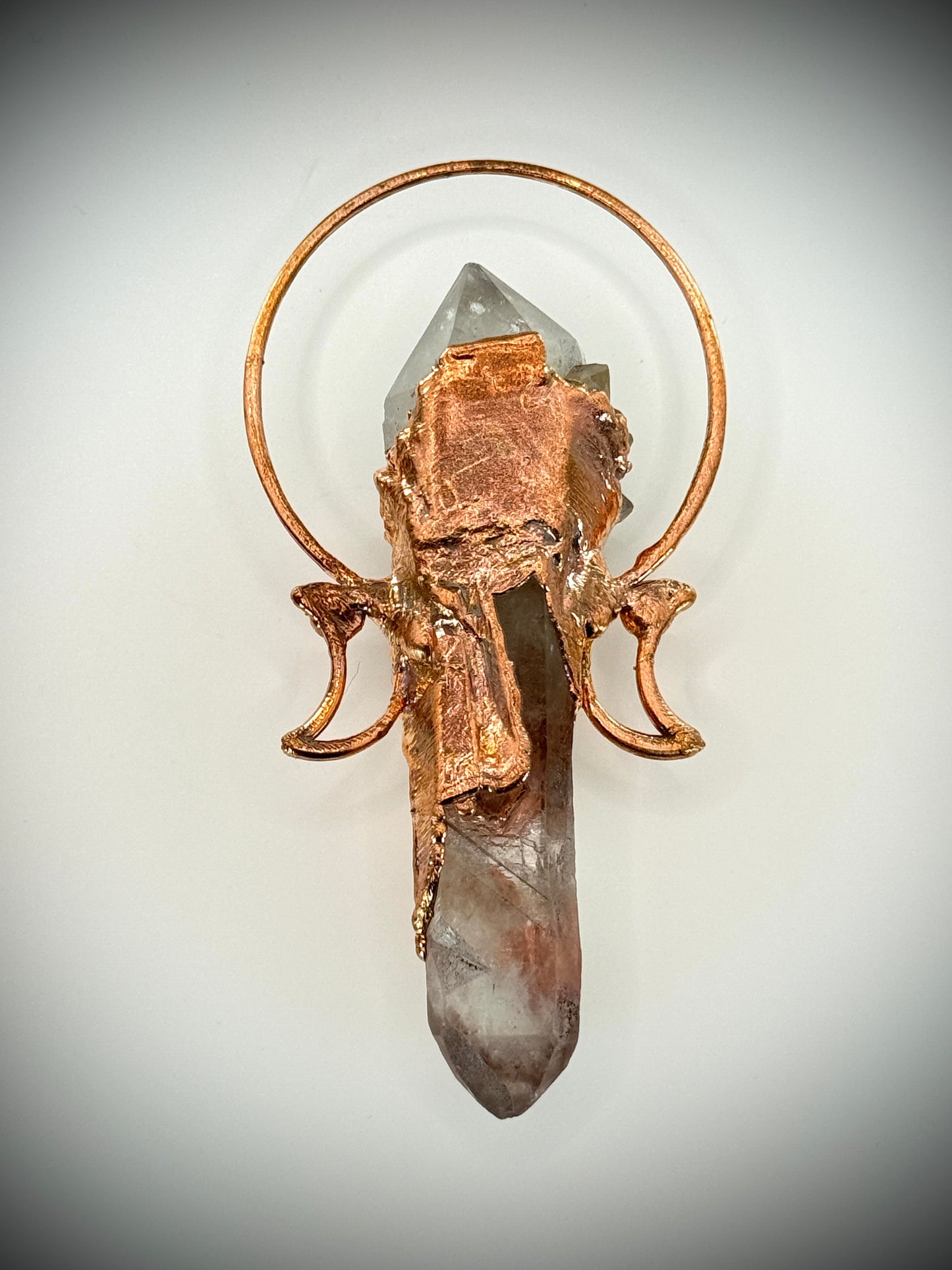 Handmade copper pendant with smoky quartz cluster, clear quartz point with crystal imprint, carnelian cabochons, and crescent moons – goddess crystal jewellery.