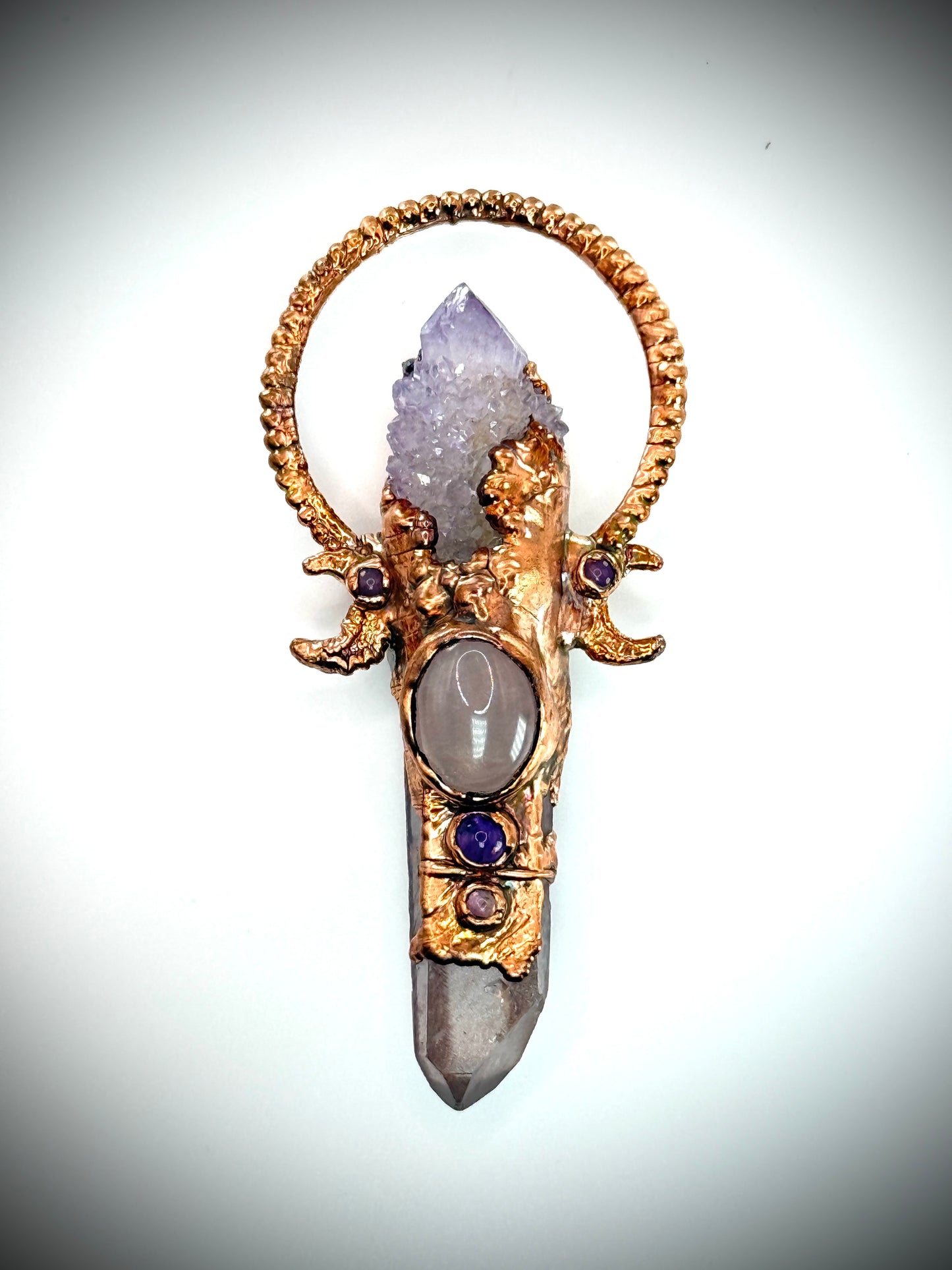 Handmade copper pendant with spirit quartz, red lithium quartz, rose quartz, amethyst, and crescent moons – crystal jewellery for love and divine connection.