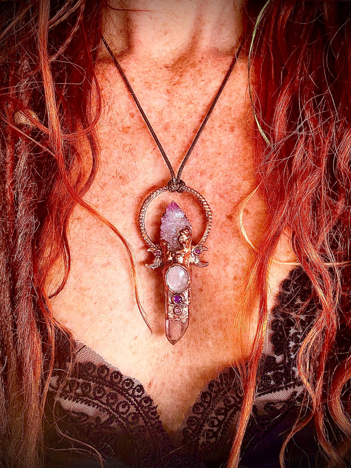 Handmade copper pendant with spirit quartz, red lithium quartz, rose quartz, amethyst, and crescent moons – crystal jewellery for love and divine connection.