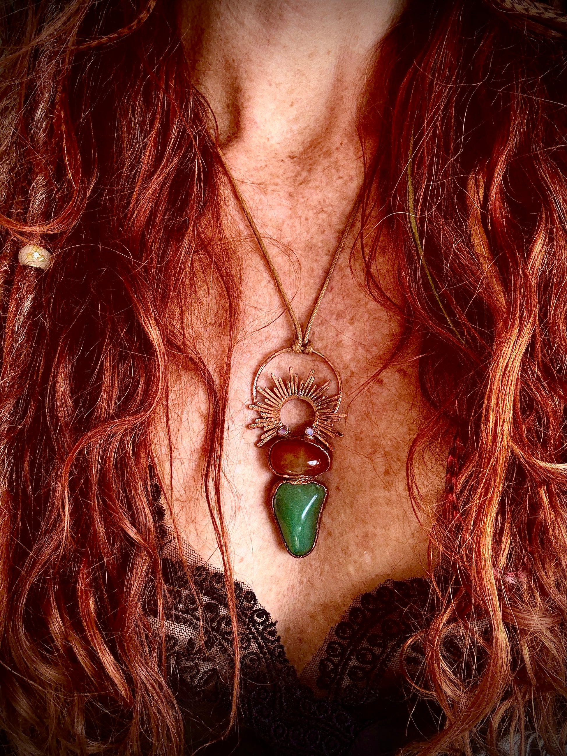 Handmade copper pendant with carnelian, green fluorite, moonstone accents, and sunburst detail – crystal jewellery for emotional balance and intuitive power.