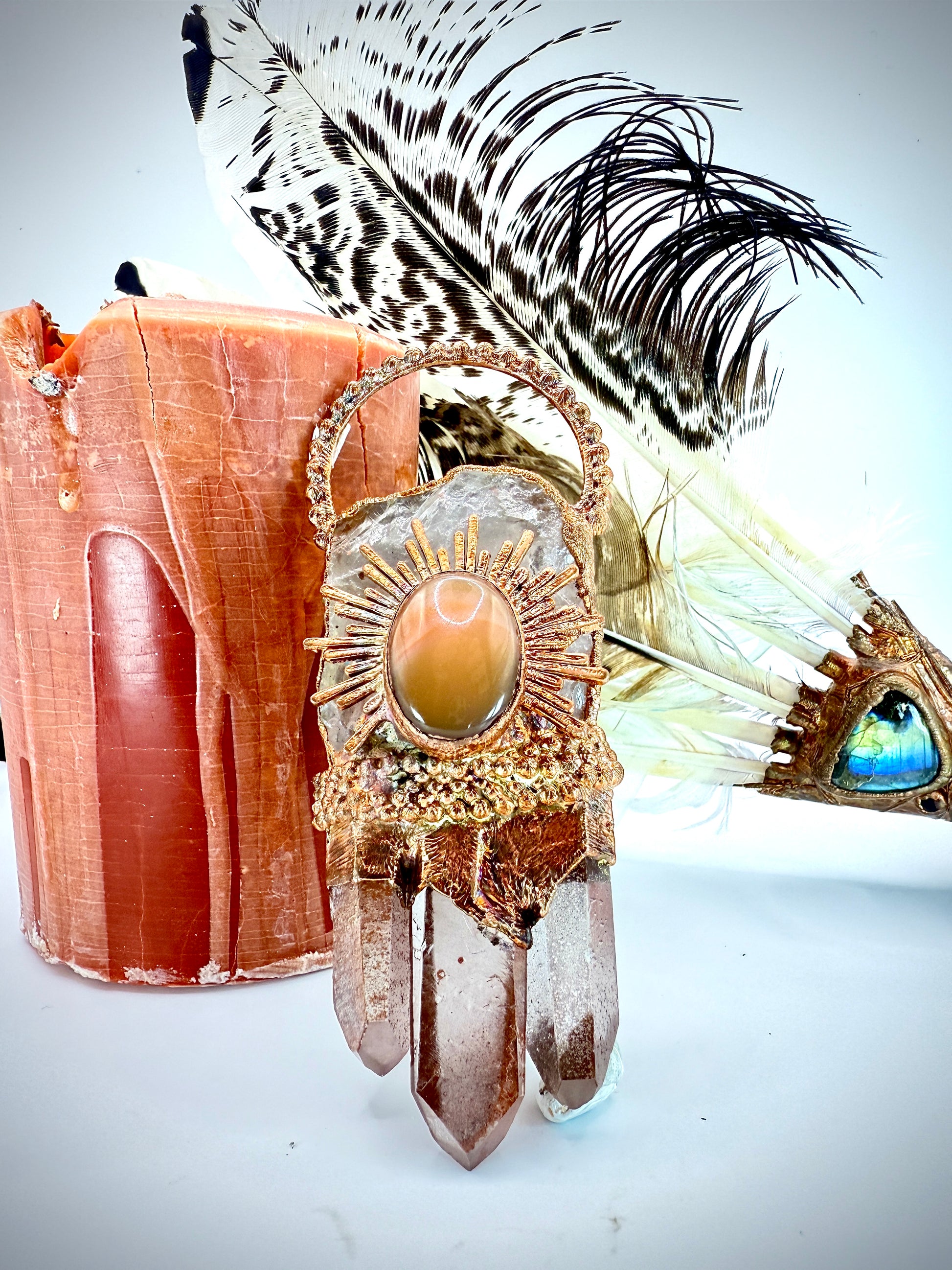 Handmade copper pendant with clear quartz crown, red lithium quartz points, carnelian cabochon, and sunburst accent – fiery crystal statement jewellery.