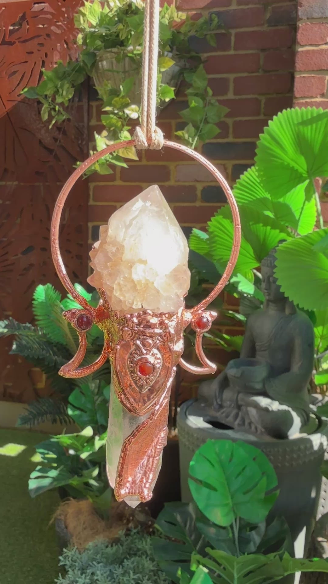 Goddess-inspired pendant with smoky quartz and clear quartz point bearing a crystal growth imprint – accented with copper and carnelian.
