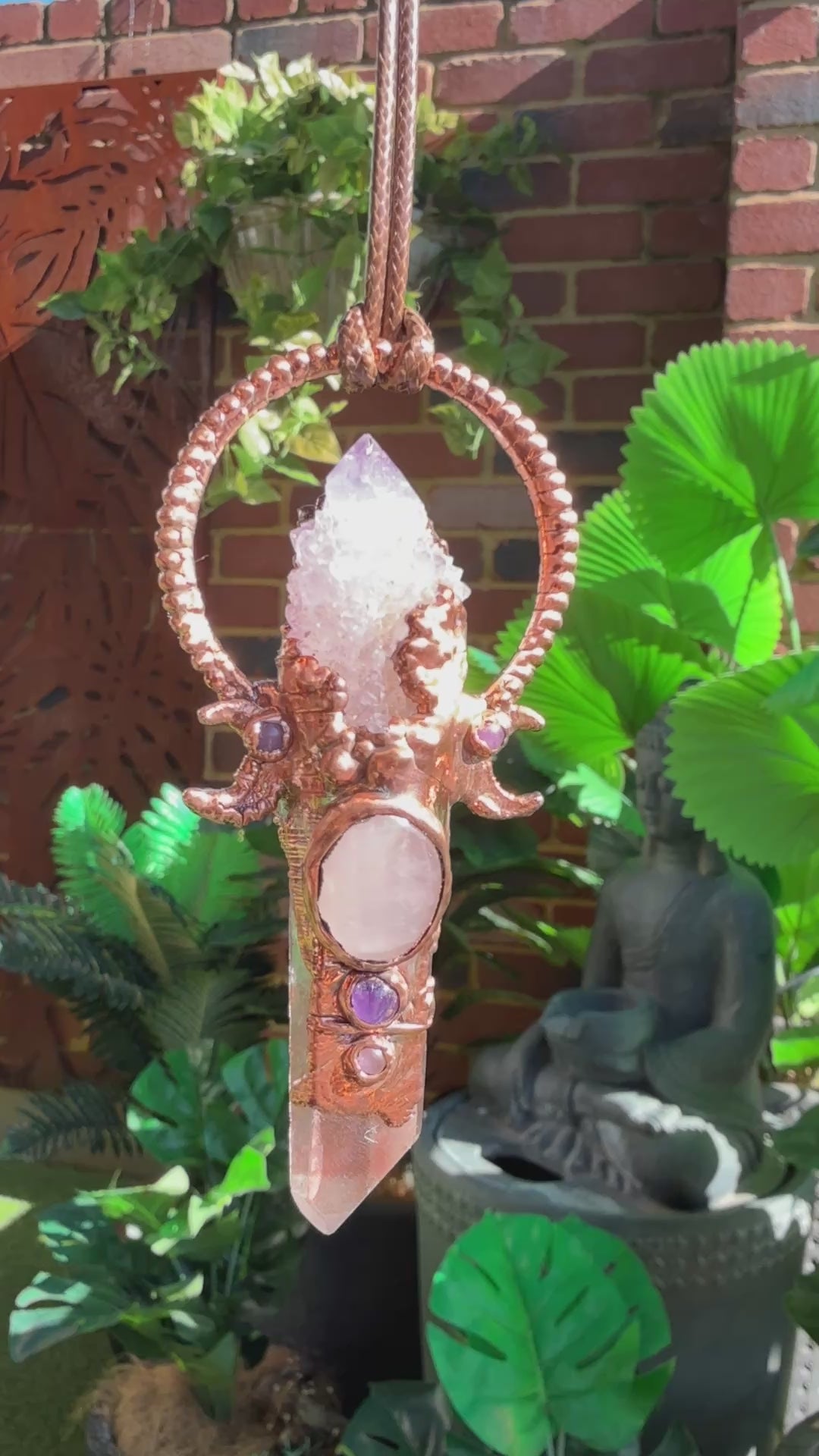 Handmade copper pendant with spirit quartz, red lithium quartz, rose quartz, amethyst, and crescent moons – crystal jewellery for love and divine connection.