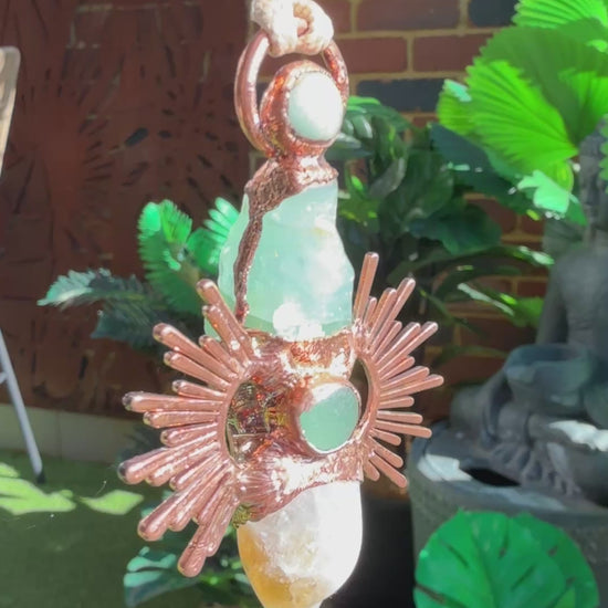 Handmade copper pendant with citrine and green calcite – sunburst design crystal jewellery for confidence and heart healing.