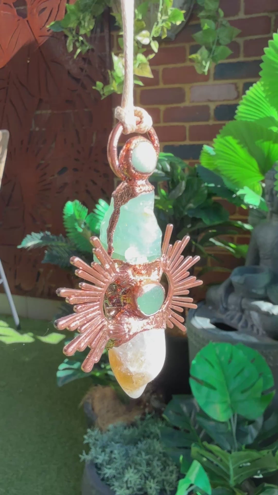 Handmade copper pendant with citrine and green calcite – sunburst design crystal jewellery for confidence and heart healing.