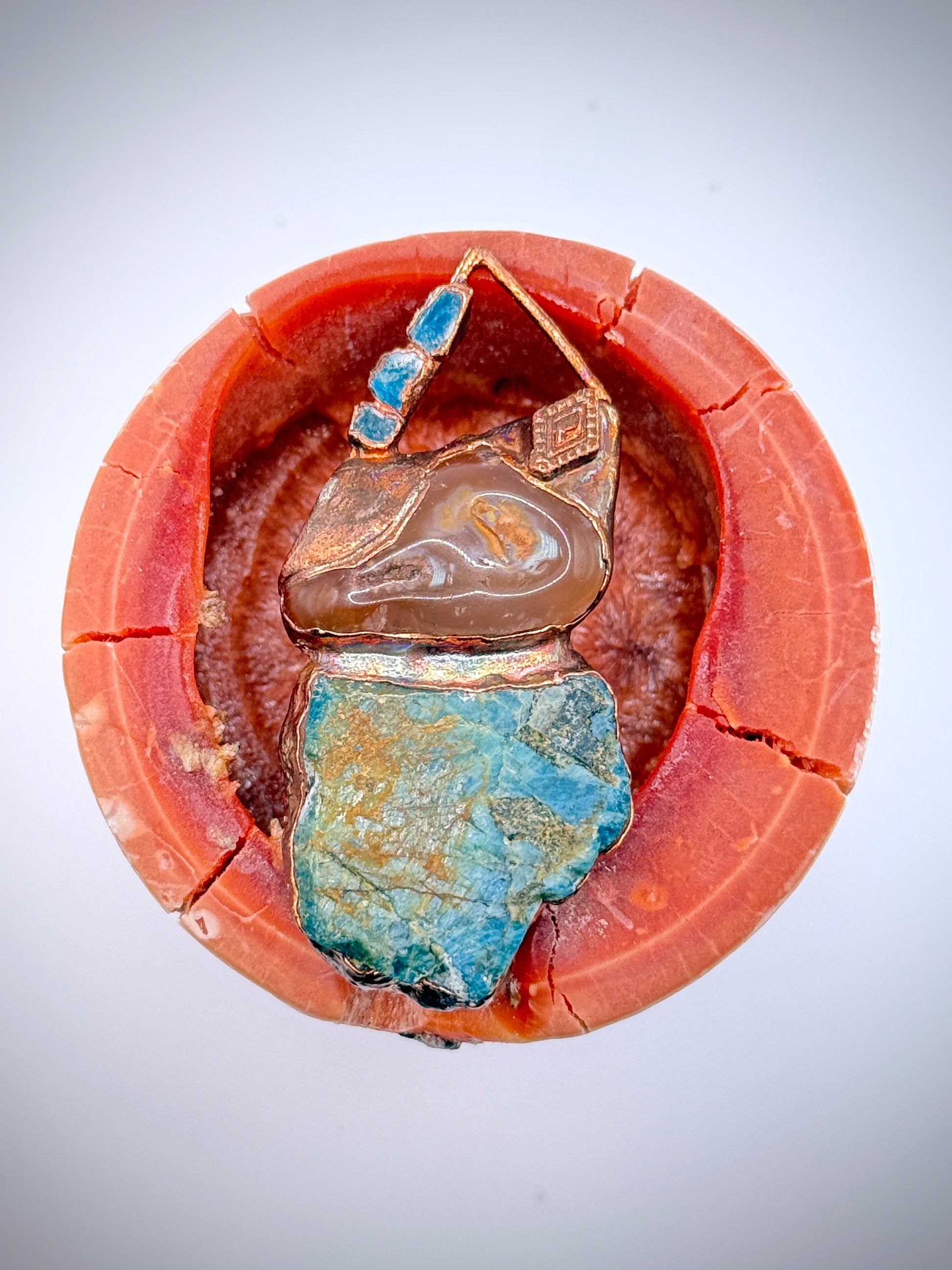 Handmade copper pendant with raw blue apatite, carnelian, and triangular top – funky crystal jewellery for creative expression and throat chakra alignment.
